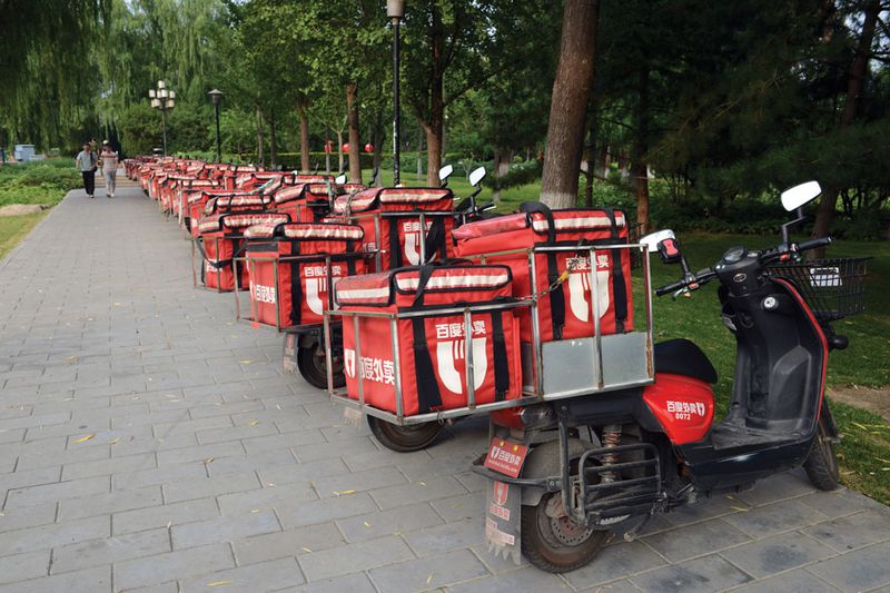 A gathering spot of Baidu&#x27;s food delivery army by the Second Ring Road in Beijing
