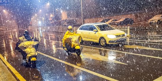 Delivery drivers in snowstorm